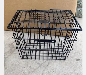 Detailed view of black metal bicycle basket with lid, sturdy wire mesh design for front mount.