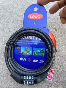 Detailed view of the 4-digit bicycle cable lock with secure combination and hanging card.
