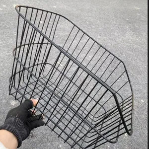 Black metal wire bicycle rear basket detail, sturdy mesh design for bike rack storage.