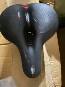 Ergonomic black bicycle saddle with center ventilation cutout for comfortable long distance rides.