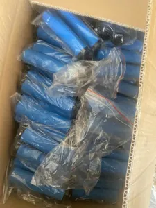 Detail view of blue rubber bicycle handlebar grips with non-slip texture for mountain bikes.