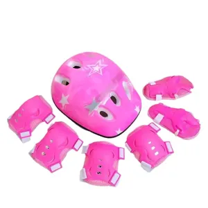 Kids roller skating helmet and protective gear set in pink with star pattern, detail view.