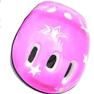 Pink kids safety helmet detail featuring ventilation holes and cute white star print.