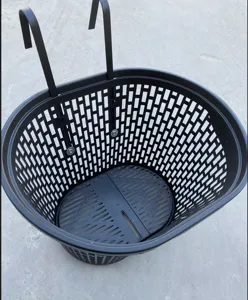 Detailed view of black plastic bicycle front basket with hooks, sturdy mesh design structure.