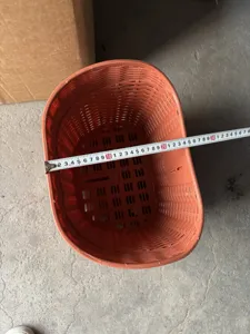 Plastic front bicycle basket with mesh design, durable storage container for bikes and e-bikes.