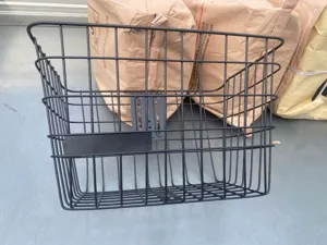 Durable black metal front bicycle basket with mounting bracket for mountain and electric bikes.