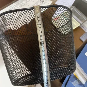 Black metal wire mesh basket storage bin organizer for home office or bicycle front use.