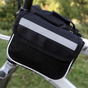 Closeup view of a black bicycle handlebar bag with reflective strip and mesh pocket.