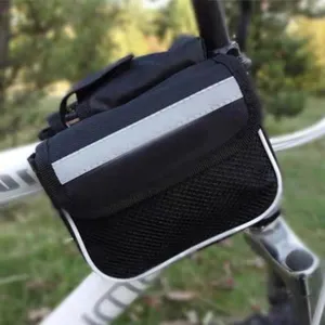 Close-up detail of black bicycle top tube bag with reflective strip and mesh pocket.