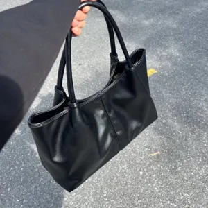 Minimalist black PU leather tote bag for women, large capacity shoulder handbag casual daily.