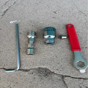 Detailed view of bicycle bottom bracket removal tool set, including hex wrench and puller.
