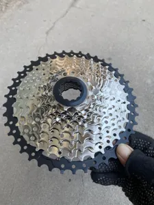 Mountain bike cassette sprocket detail view showing silver and black metal gear parts.