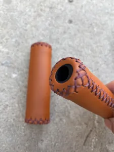 Retro bicycle handlebar grips detail, brown PU leather hand-stitched wrap for fixed gear.