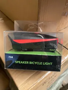 Detail view of bicycle speaker light in transparent packaging box with model 758