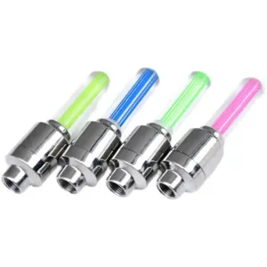 Close-up of colorful LED bicycle tire valve lights with metal base and glowing tubes.