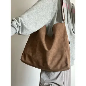 Large capacity brown slouchy tote bag for women, commuter shoulder handbag for students.