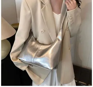 Silver metallic soft leather hobo underarm bag detail, trendy casual women shoulder bag style.