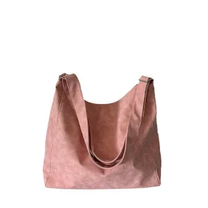 Large capacity pink slouchy shoulder bag for women, stylish tote handbag for daily commute.