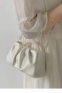 White pleated cloud handbag for women, elegant pearl handle mini crossbody bag daily.