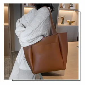 Classic brown large capacity tote bag detail view, versatile shoulder bag for daily wear.