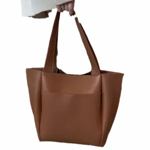 Stylish large capacity brown leather tote bag for women, versatile everyday shoulder handbag.