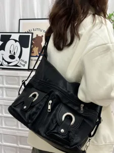 Black leather shoulder bag for women, large capacity casual crossbody bag with multiple zip pockets.