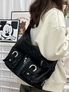 Casual black PU leather crossbody shoulder bag for women, large capacity multi-pocket travel.