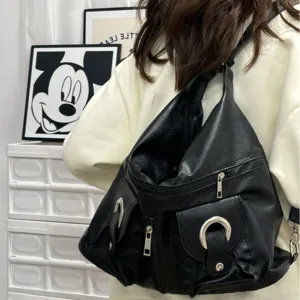 Casual black PU leather backpack for women, large capacity stylish travel daypack.