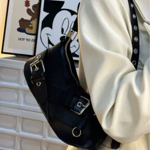 Detailed view of a stylish black leather motorcycle shoulder bag with metal buckles and zipper.