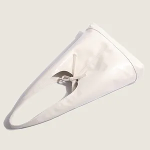 Soft leather shoulder tote bag detail showing elegant bow knot and minimalist design.
