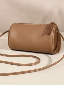 Brown cylindrical crossbody bag for women, stylish autumn winter PU leather shoulder bag.