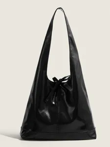 Black soft leather commuter shoulder bag hobo tote with chic bow detail for daily wear.