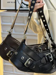 Stylish leather motorcycle shoulder bag with metal grommets and buckles for women and girls.