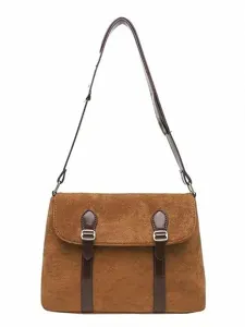 Vintage brown suede crossbody messenger bag for women with adjustable strap and chic buckles.