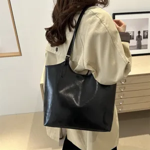 Classic black tote bag for women, large capacity shoulder bag, stylish commuter PU leather bag.