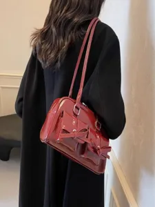 Chic patent red shoulder bag with bow and pockets, elegant balletcore style daily purse for women.