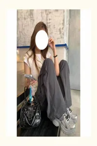 Black oily leather motorcycle underarm bag, trendy commuter shoulder bag with metal details.