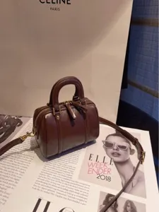 Vintage brown leather boston handbag with top handle and crossbody strap for women fashion