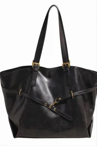 Black leather tote bag featuring stylish metal buckles, double shoulder straps and front strap.