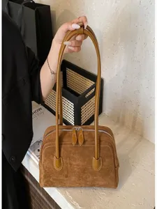 Retro suede shoulder bag for women, large capacity commuter tote handbag with double handles.
