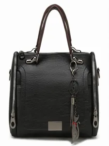 Black leather Boston handbag for women, top handle shoulder crossbody bag with cat charm.
