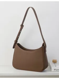 Minimalist brown underarm shoulder bag, stylish PU leather hobo bag for women daily wear.