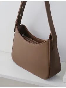 Classic brown women's underarm shoulder bag, versatile daily handbag with zipper closure.
