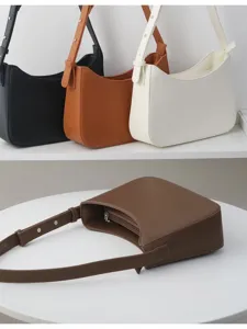 Minimalist solid color PU leather underarm shoulder bag with adjustable strap and zip pocket.