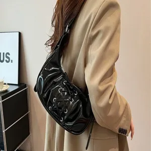 Black patent leather shoulder bag with side lacing and pleats, trendy balletcore hobo handbag for women