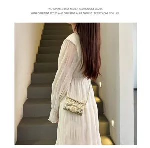 Elegant mini quilted chain bag detail view in chic interior setting, fashion accessory.