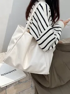 Detailed view of a white PU leather shoulder tote bag, large capacity and minimalist design.