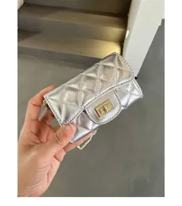 Silver quilted mini chain crossbody bag, chic metallic shoulder bag for women daily.