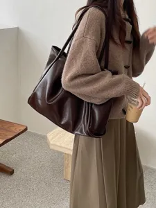 Women's large capacity shoulder tote bag, chic brown PU leather casual handbag for daily use.