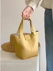 Yellow PU soft leather bucket handbag with top handles, casual style for daily wear.